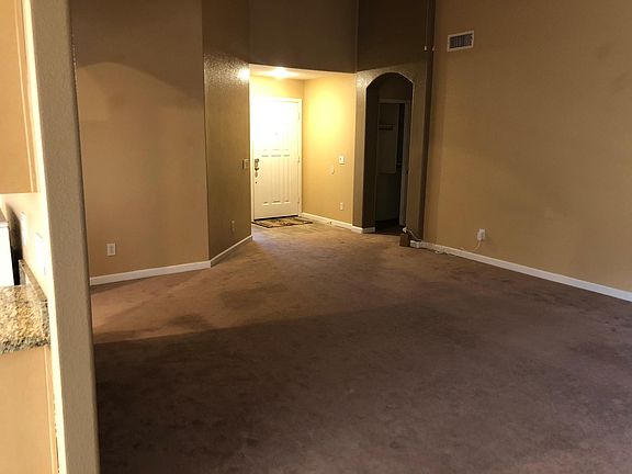 Living room showing the main entrance.