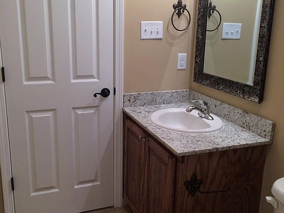 Bathroom 1; granite counter tops, custom wood cabinets