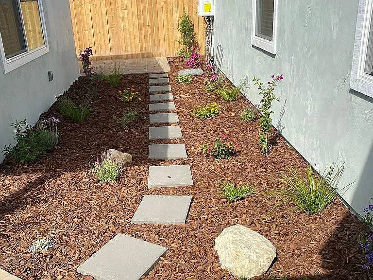 side yard, fresh plants and mulch.
