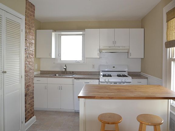 eat in kitchen with exposed brick
