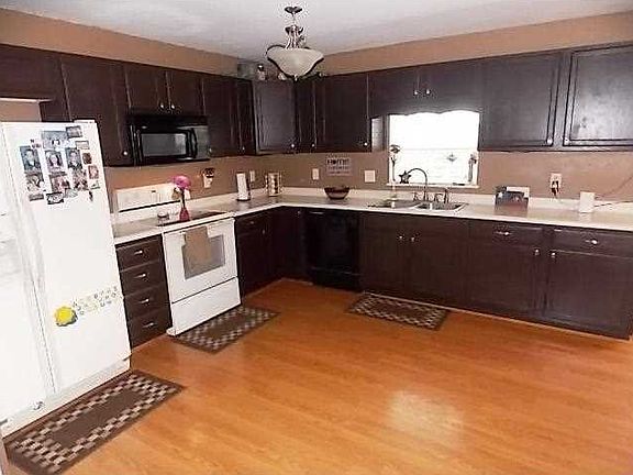 Kitchen. Huge 19 X 15 kitchen with hardwood flooring and appliances are staying.