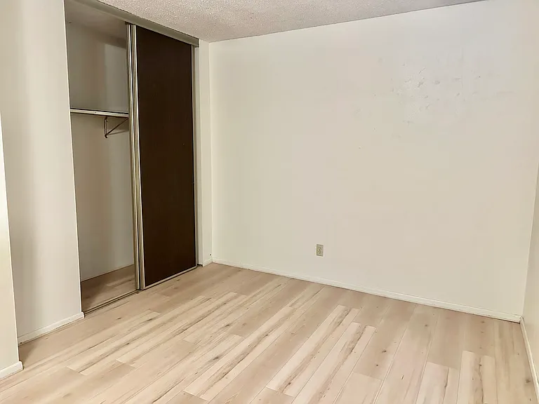 Bedroom with he's and hers closet
