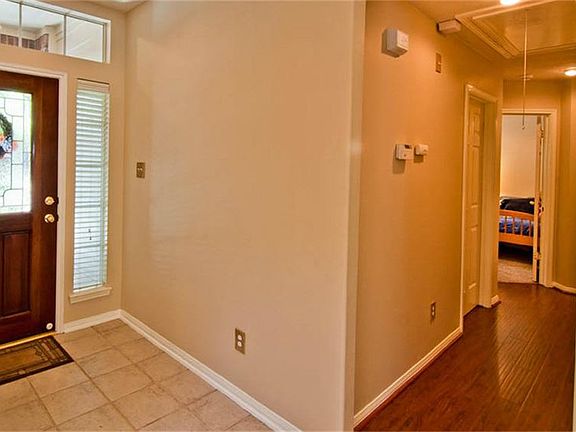 Step into the tiled foyer. To the left are the 3 secondary bedrooms.