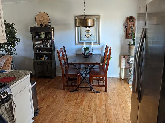 view to dining area from kitchen; all wood floors upstairs