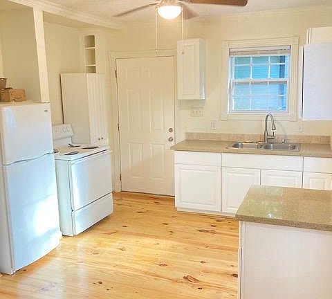 Kitchen Area with Granite Counter Tops.