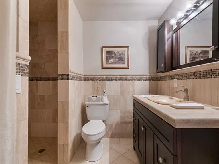 Private bath off of ground floor bedroom or 2nd living space