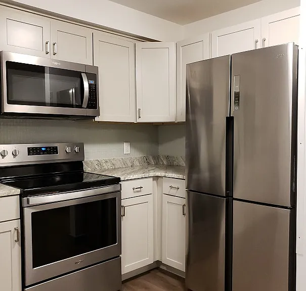 Kitchen - Large Stainless Steel Fridge, microwave and stove for your upgraded lifesyle