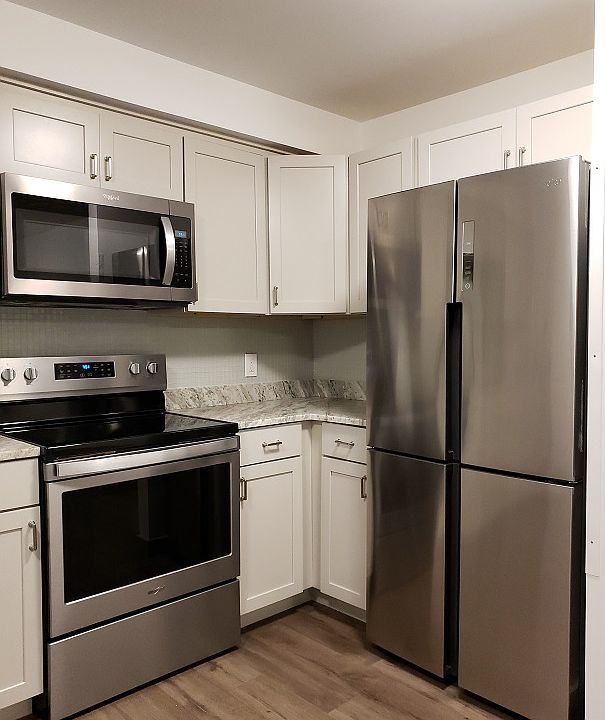 Kitchen - Large Stainless Steel Fridge, microwave and stove for your upgraded lifesyle