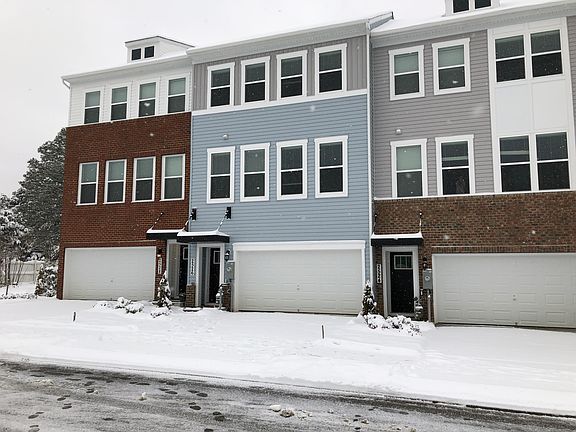 Front of home during winter snow. Light Blue