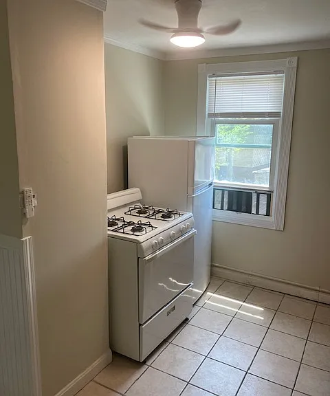 kitchen- also has cabinet, sink, and portable island counter