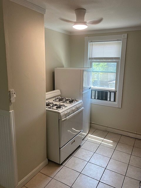 kitchen- also has cabinet, sink, and portable island counter