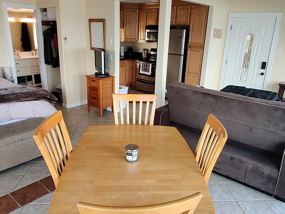 55" TV with Internet (2 TV's), Couch folds out to full sized bed, dining table w/ 4 chairs.