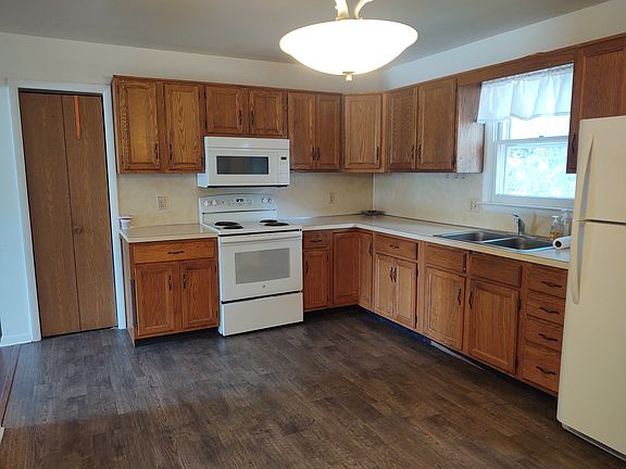 Country style eat-in kitchen with closet and tons of storage space.