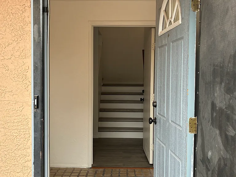 Front entryway. Turn left to the downstairs suite or go up to the primary area
