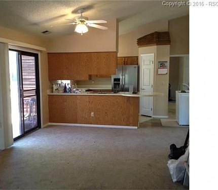 View from great room to kitchen and deck entry