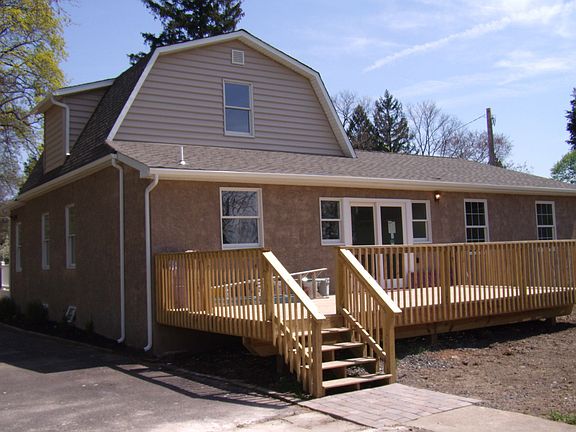 Back of house with brand new deck.