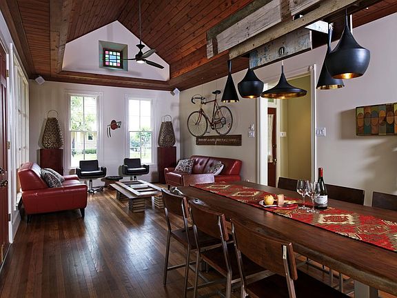 A look at the main Living Space and dining table and its custom light fixture