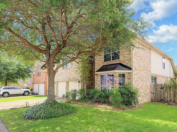 Mature tree shades the home