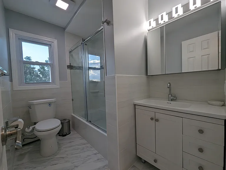 Newly gut-renovated full bath with tub.