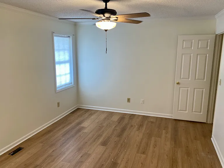 Each bedroom has a new fan for quiet operation. Two lovely windows with shades overlook your backyard.