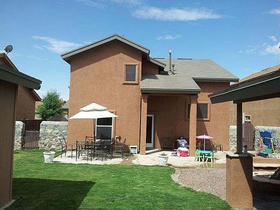 Rear view of property w/ extended patio