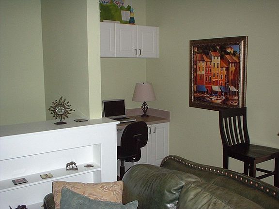 Living room with a view of computer area