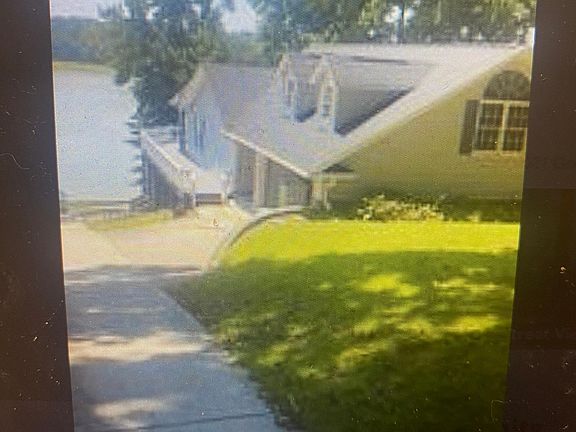 Welcome Home! Sights of the lake as soon as you enter the driveway of this waterfront paradise!