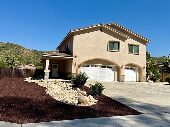 Front yard of home, 3-car garage