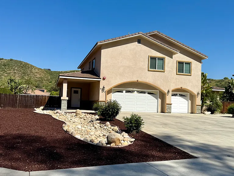 Front yard of home, 3-car garage