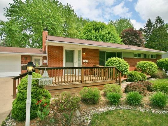 Professional landscaping surrounds the wood deck off the front of the home. A two car garage is nicely finished and insulated making sure the snow melts off your car during winter months.