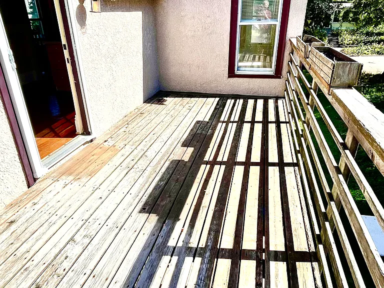 Back yard upper deck South facing.