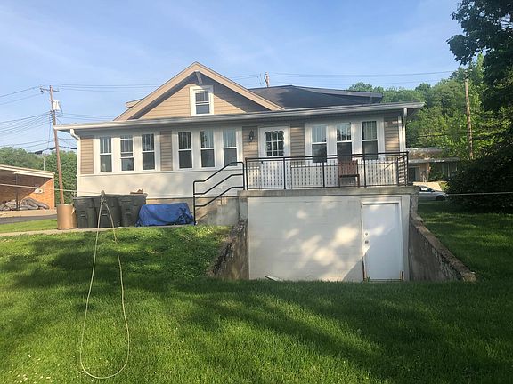 Back of the house, the windows are in the sunroom and you can see the walkout basement