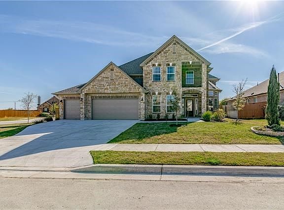 Three car garage! Nice covered front porch and balcony.
