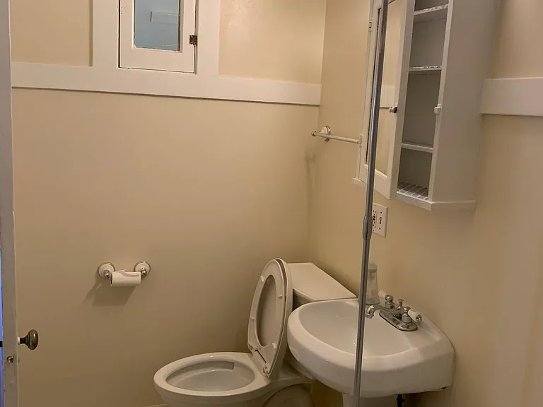 Bathroom with marble floor and claw-foot tub