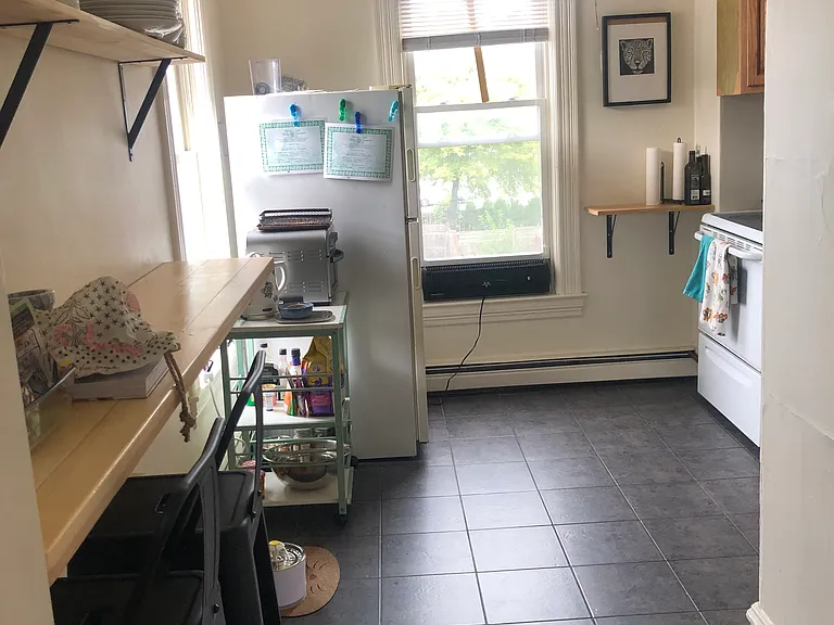 Kitchen, looking in from hallway. Two windows -bright room.