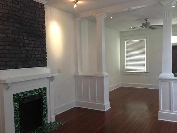 Living and Dining areas features hardwood floors and original fireplace and mantel