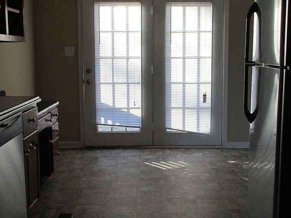 Galley Kitchen with French Doors to Back Deck