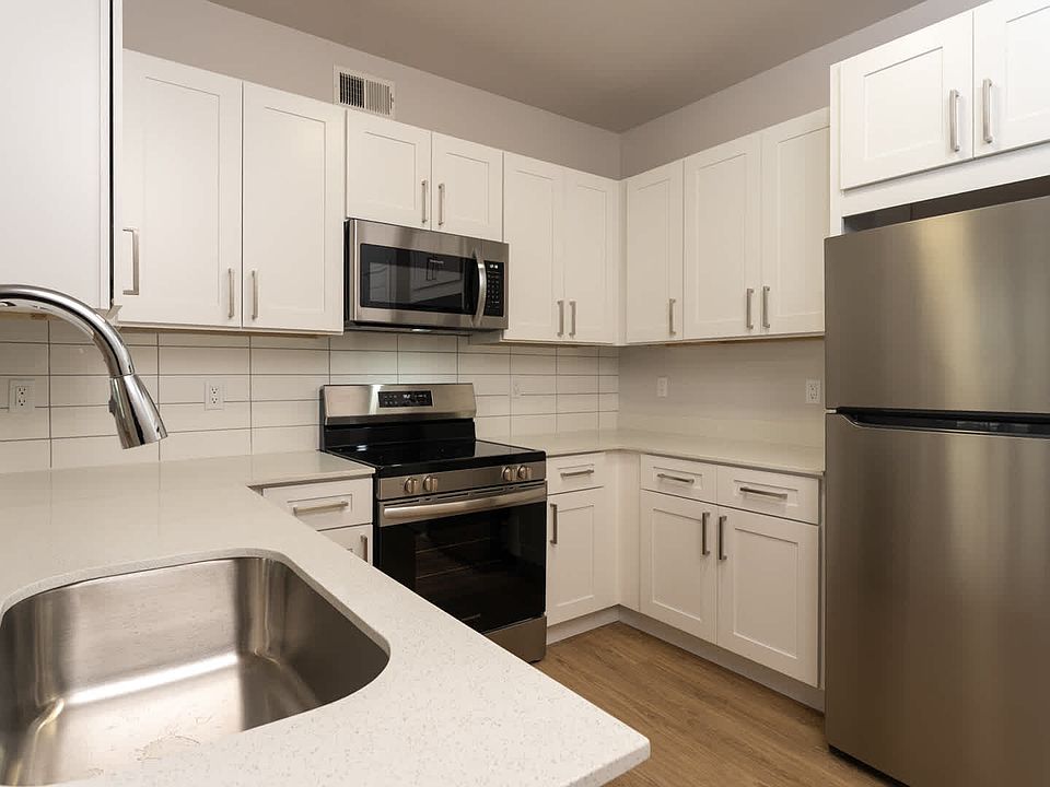 Kitchen with island and hard surface flooring
