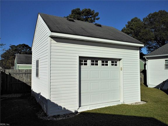Outbuilding has Power + Full Sized Garage Door!
