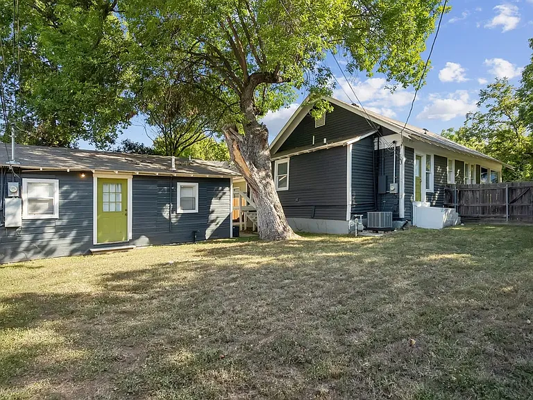 Shared backyard. Door on the left is the backdoor of the backhouse.