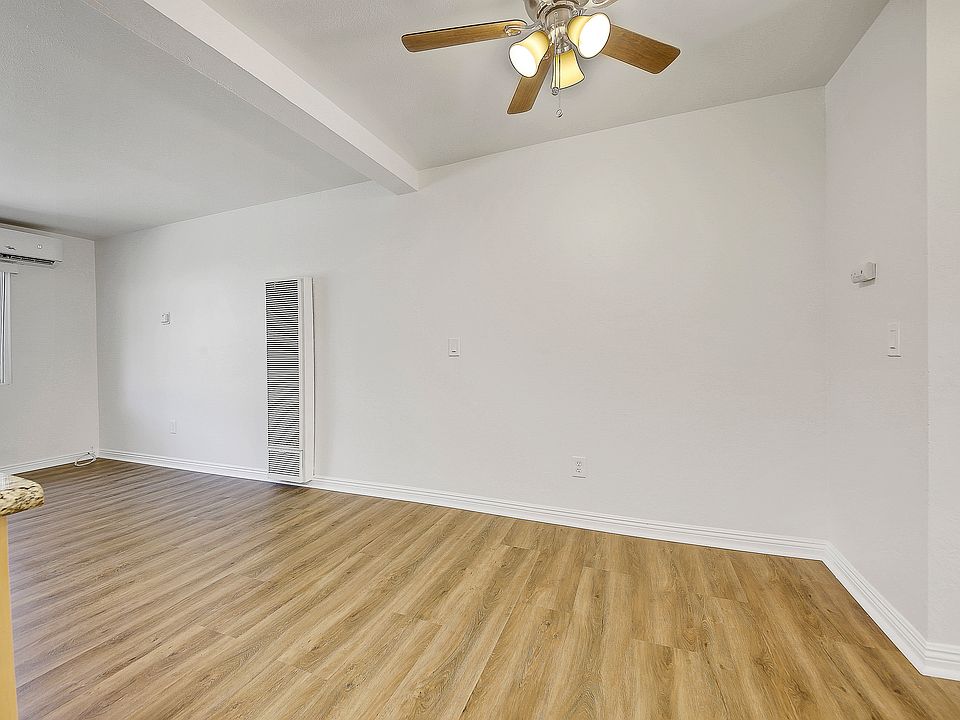 Different but similar unit. Now has new grey floors and contemporary ceiling fans