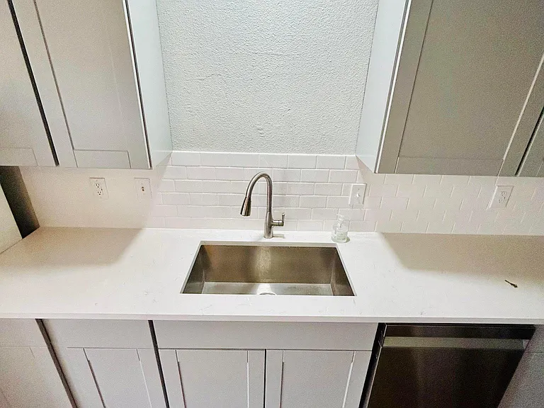 New Carrera Quartz countertops, new square stainless steel sink, new faucets, new backsplash, new appliances