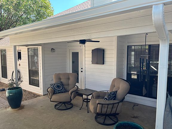 Back patio with ceiling fan