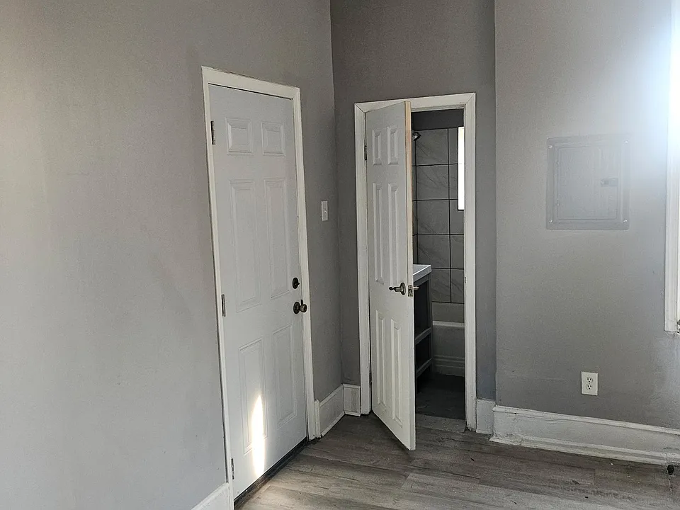 Kitchen exit door/ view of bathroom door