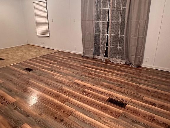 Living room sliding glass door that leads to deck