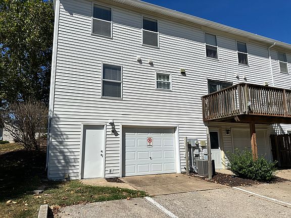 Rear entry garage with 2 parking spaces with easy access to dumpster