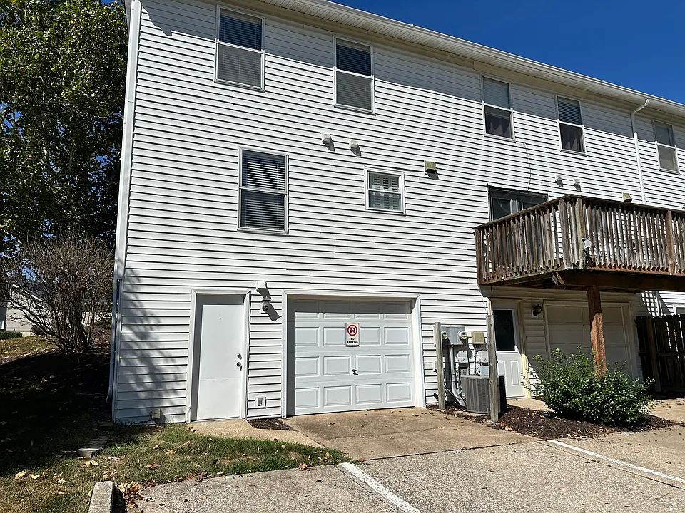 Rear entry garage with 2 parking spaces with easy access to dumpster