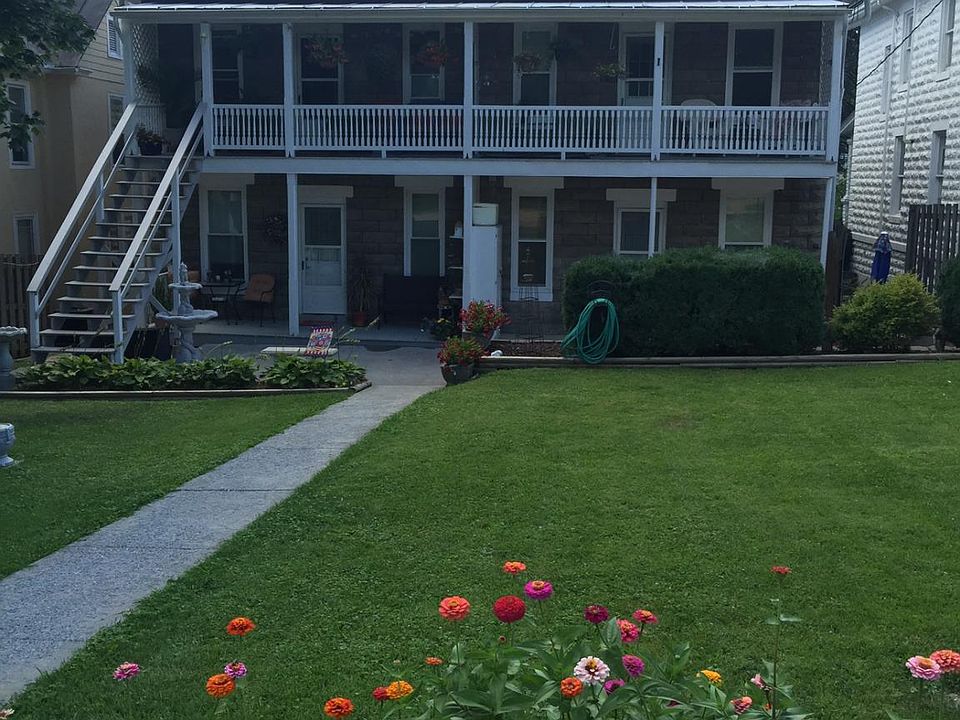 Rear of building Off street parking for one vehicle per unit Lovely yard & patio area