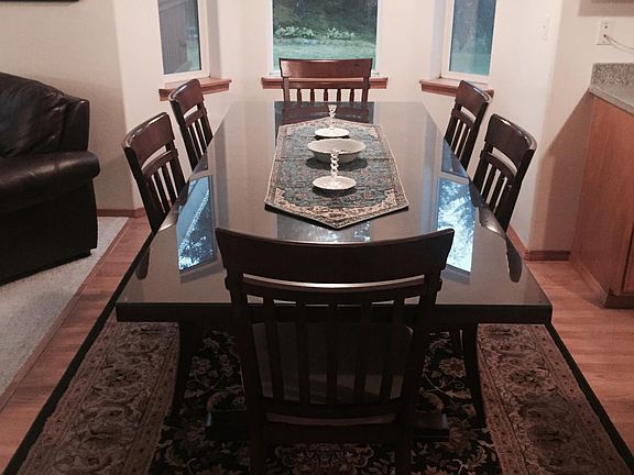 Dining room with tempered glass table.