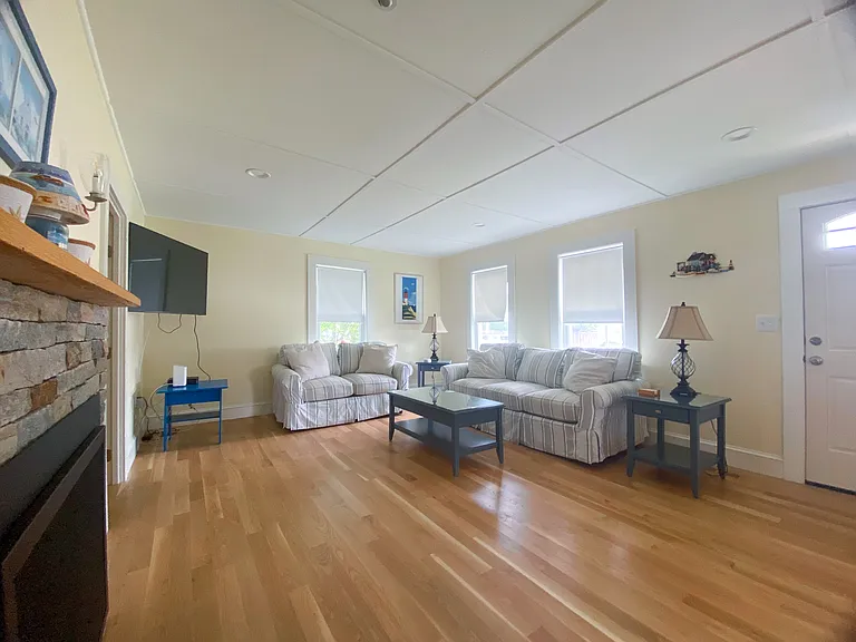 Living Room with Fireplace and Wall Mounted TV
